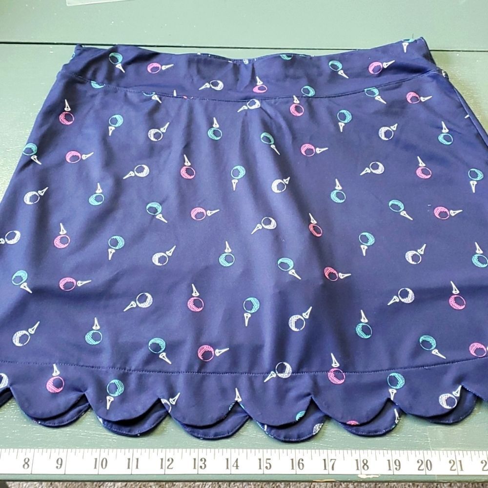 Lilly green skort. Navy‎ blue with golf balls. Size Small. Scalloped hem.